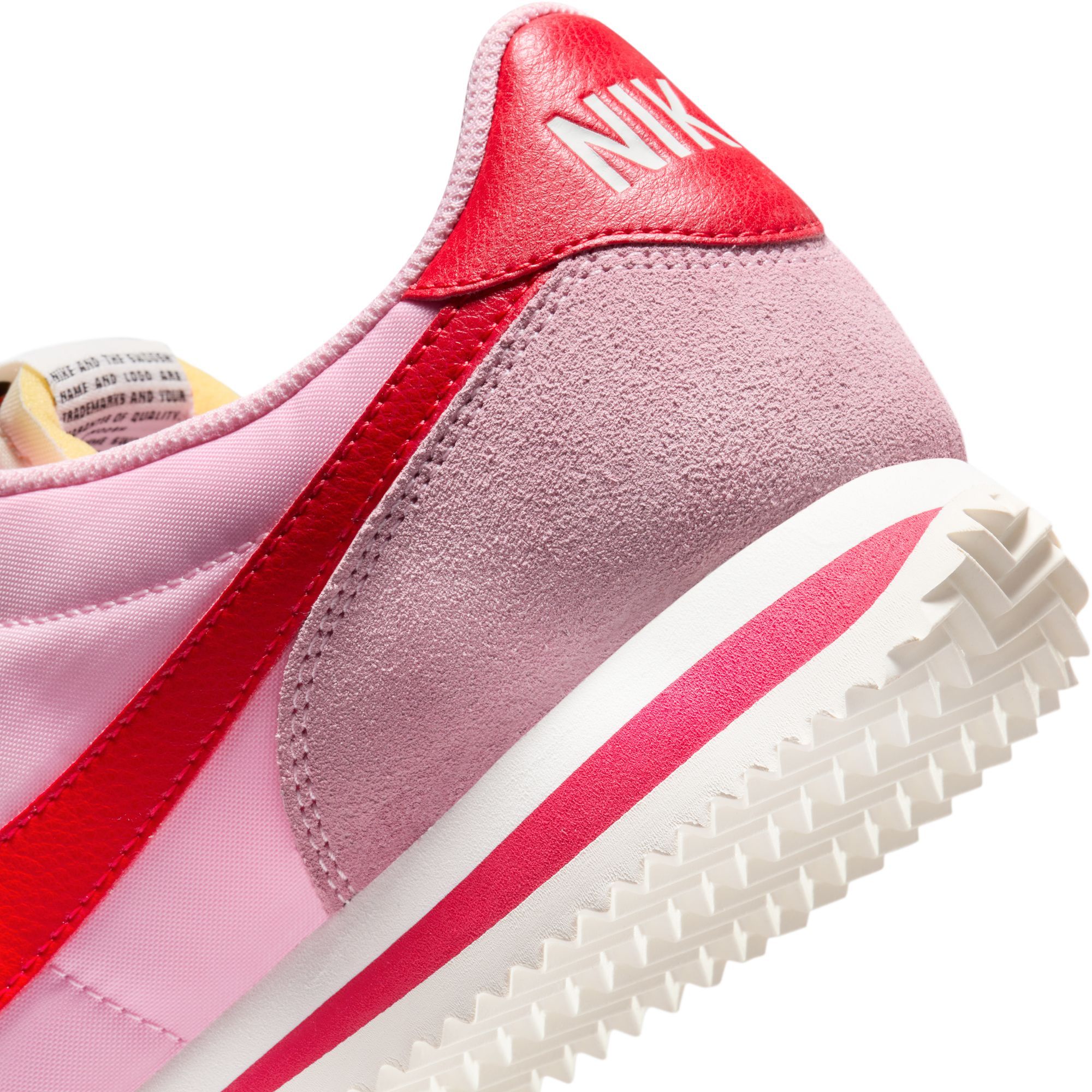 pink and red nike cortez