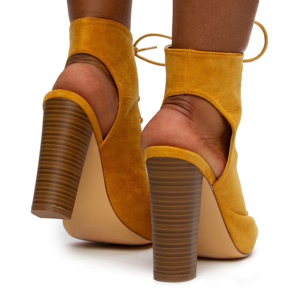sage green heeled boots