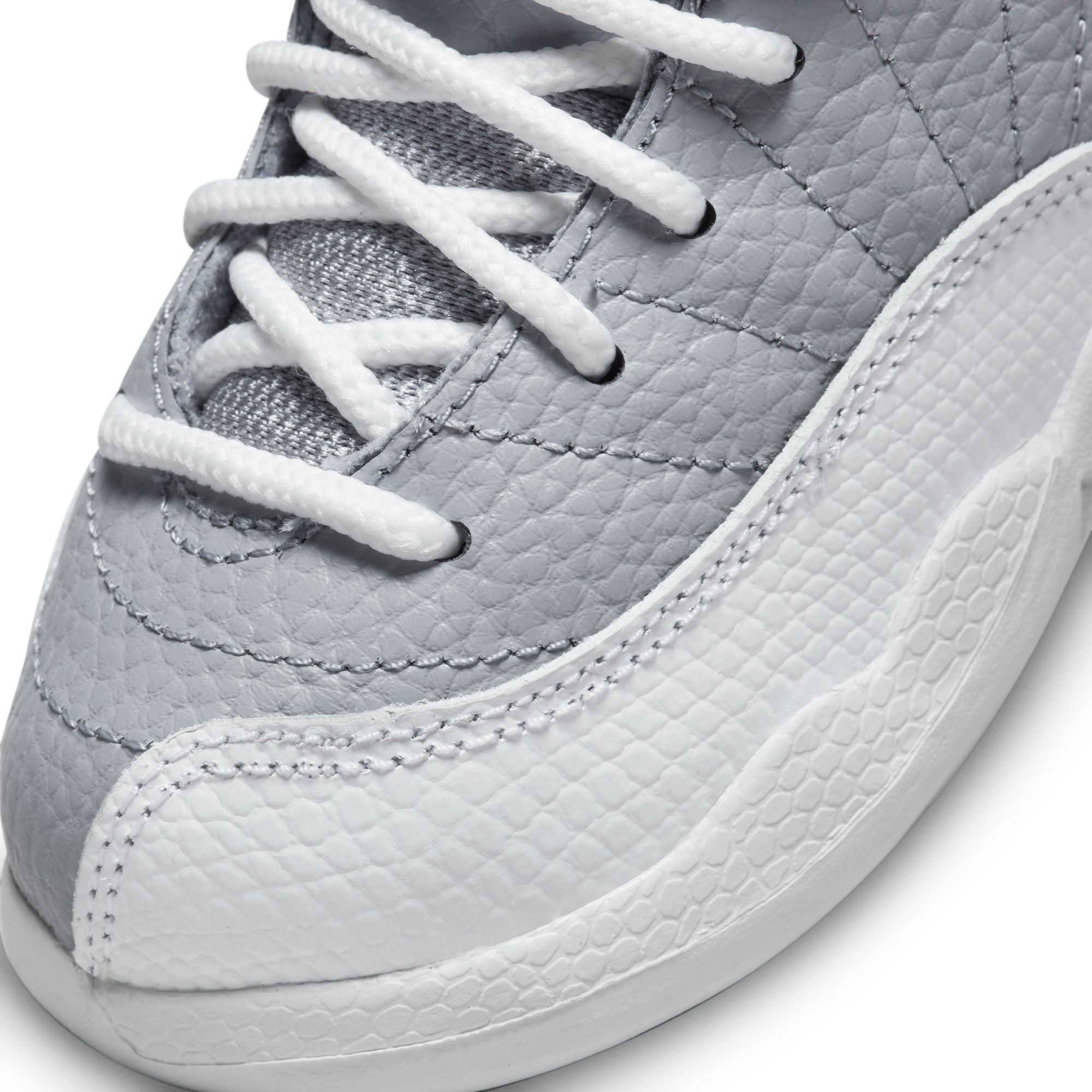 teal and white jordan 12s