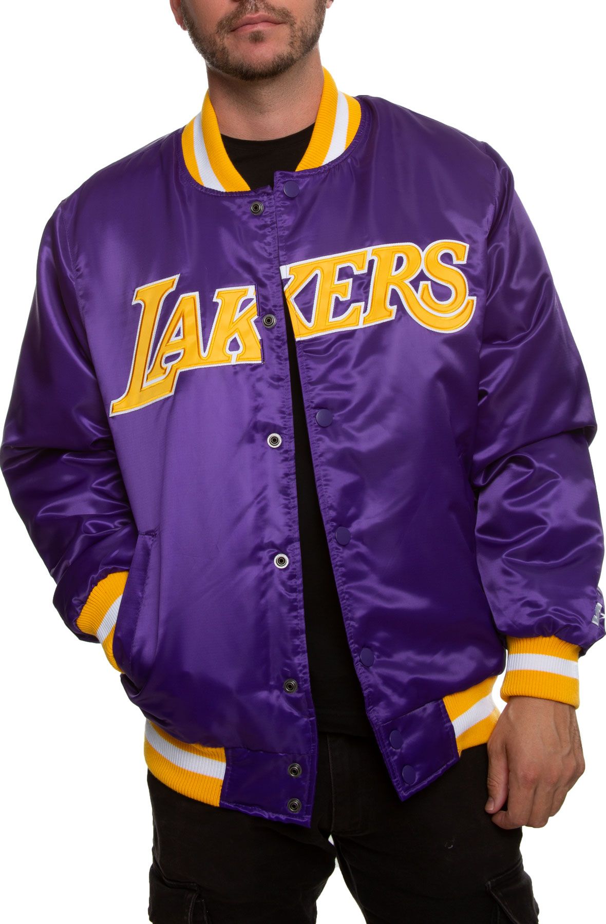 Kobe Bryant in white Lakers warmup jacket looks on before a pre