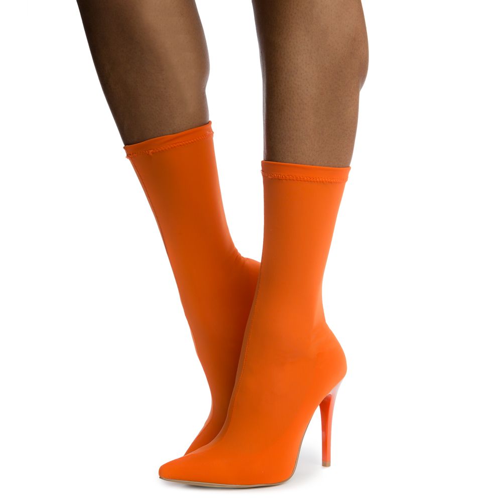 orange booties with clear heel
