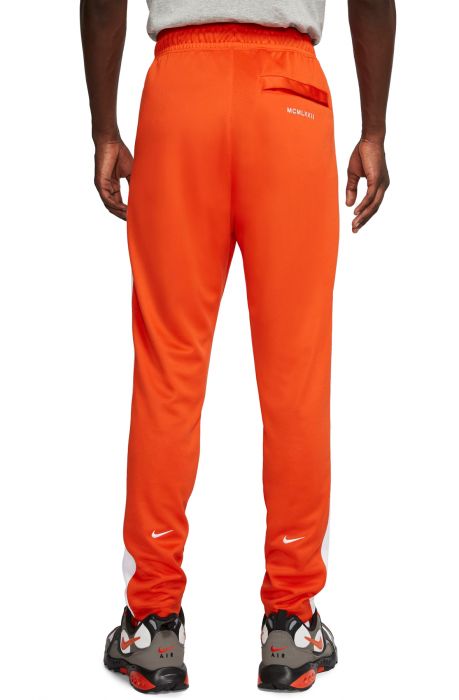 nike women's sportswear neon swoosh fleece pants orange